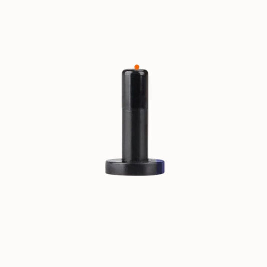 Bouchon de fin de ligne noir avec un petit point orange sur le dessus, conçu pour une sortie inutilisée