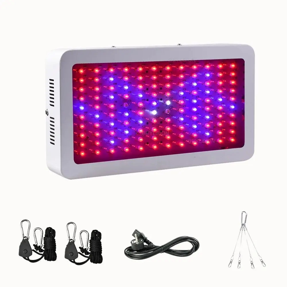 Panneau lumineux rectangulaire avec des LED rouges et bleues sur fond blanc, câbles et accessoires visibles