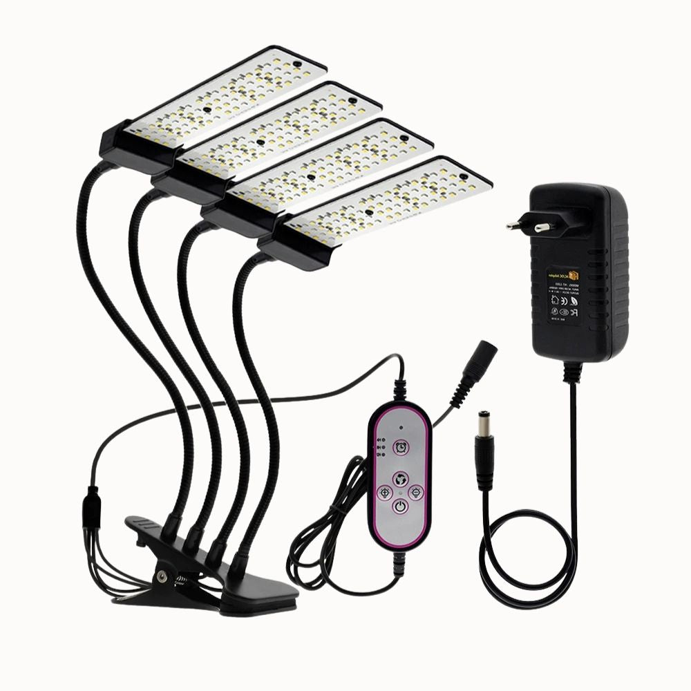 Quatre lampes LED avec bras flexibles, télécommande et adaptateur, sur un fond neutre
