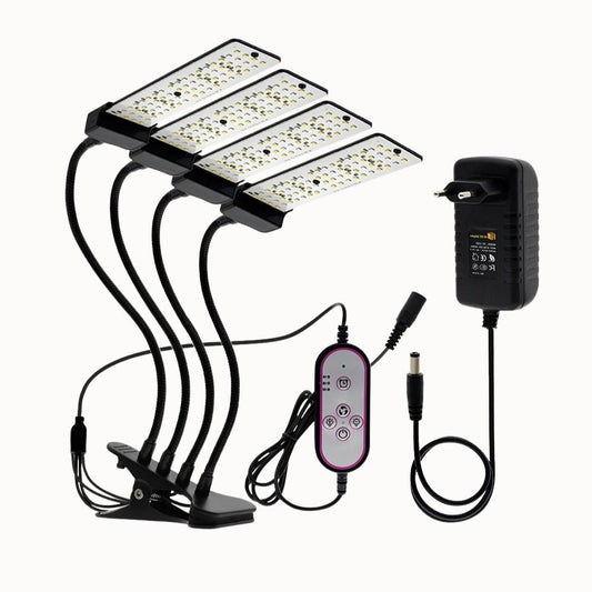 Quatre lampes LED avec bras flexibles, télécommande et adaptateur, sur un fond neutre