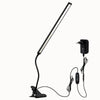 Lampe LED avec pince flexible, corps noir, long tube lumineux et câble d'alimentation visible