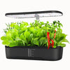Potager hydroponique noir avec des herbes vertes et des piments rouges sous une lumière LED