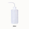 Flacon transparent de forme cylindrique avec un long bec verseur et un bouchon blanc