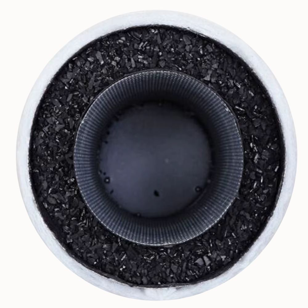 Vue aérienne d'un pot de culture circulaire avec un fond noir et une texture rugueuse