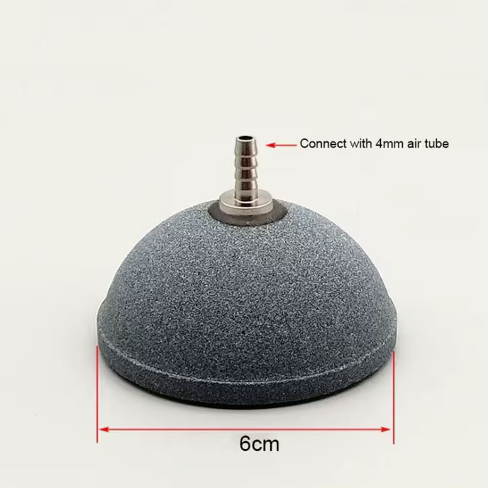 Disque diffuseur d'air circulaire en matériau gris, forme arrondie avec un tube central en métal