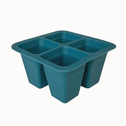 Plateau en silicone souple de couleur turquoise avec quatre compartiments carrés pour la culture