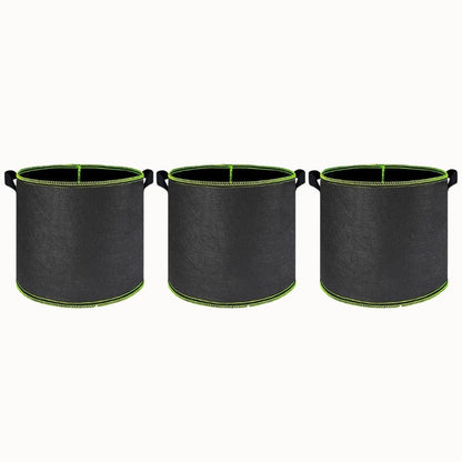 Trois pots de culture en tissu noir avec des poignées vertes et une finition lisse