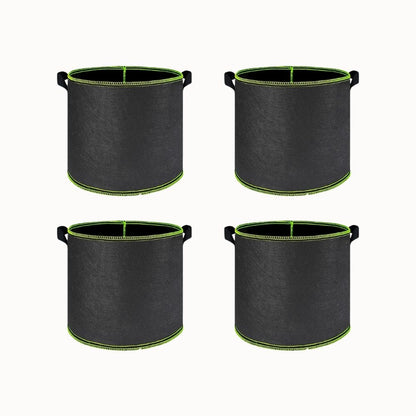 Quatre sacs en fibre noirs avec des poignées vertes, adaptés pour de grandes plantes d'intérieur