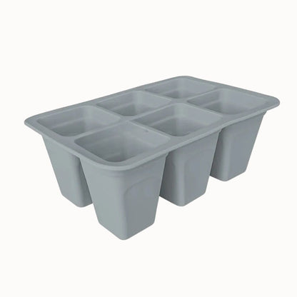 Plateau en silicone gris avec six cellules rectangulaires pour le semis de plantes