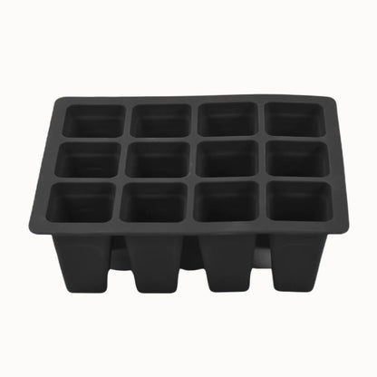 Bac en silicone noir avec douze cellules pour semis, présentant un design rectangulaire et des bords arrondis