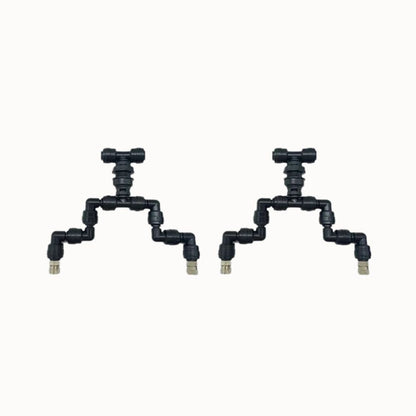 Buse de brumisation double en plastique noir avec plusieurs raccords et sorties d'eau visibles