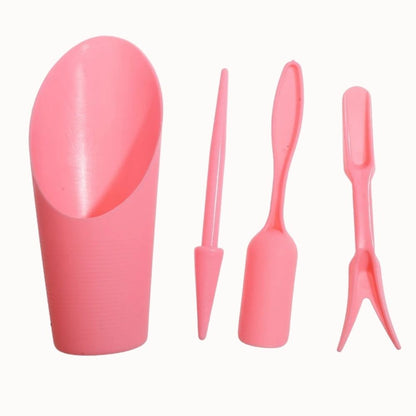 Ensemble d'outils de repiquage en plastique rose, comprenant une pelle, un plantoir et un râteau