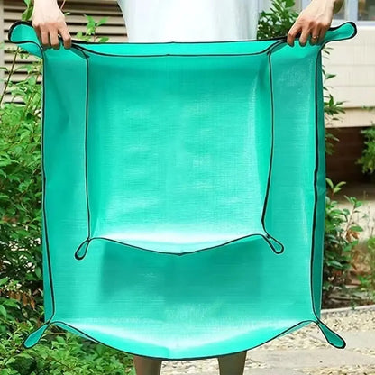 Tapis de rempotage pliable de couleur turquoise, en matière synthétique, avec des bords noirs et une forme carrée